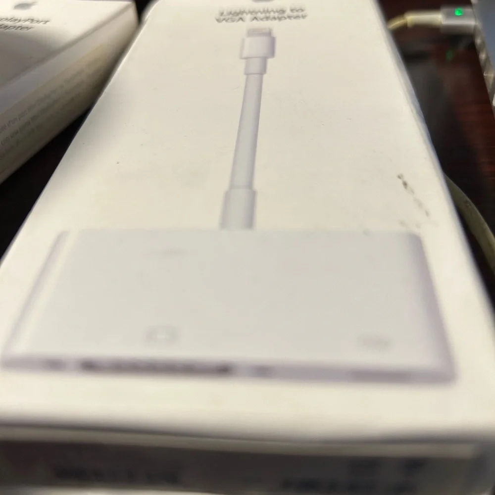 The lightening to VGA Adapter by Apple!